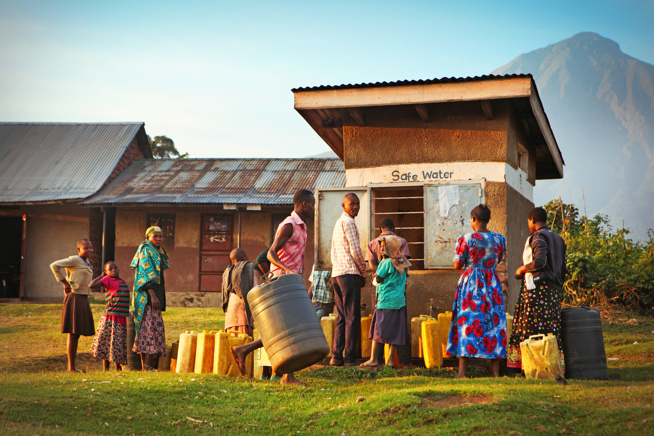 Community members collecting water, highlighting the need for Resilient WASH Solutions.